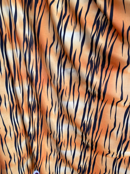 Tiger print design on poly spandex light weight 4-way stretch 58/60” Sold by the YD. Ships worldwide from Los Angeles California USA.