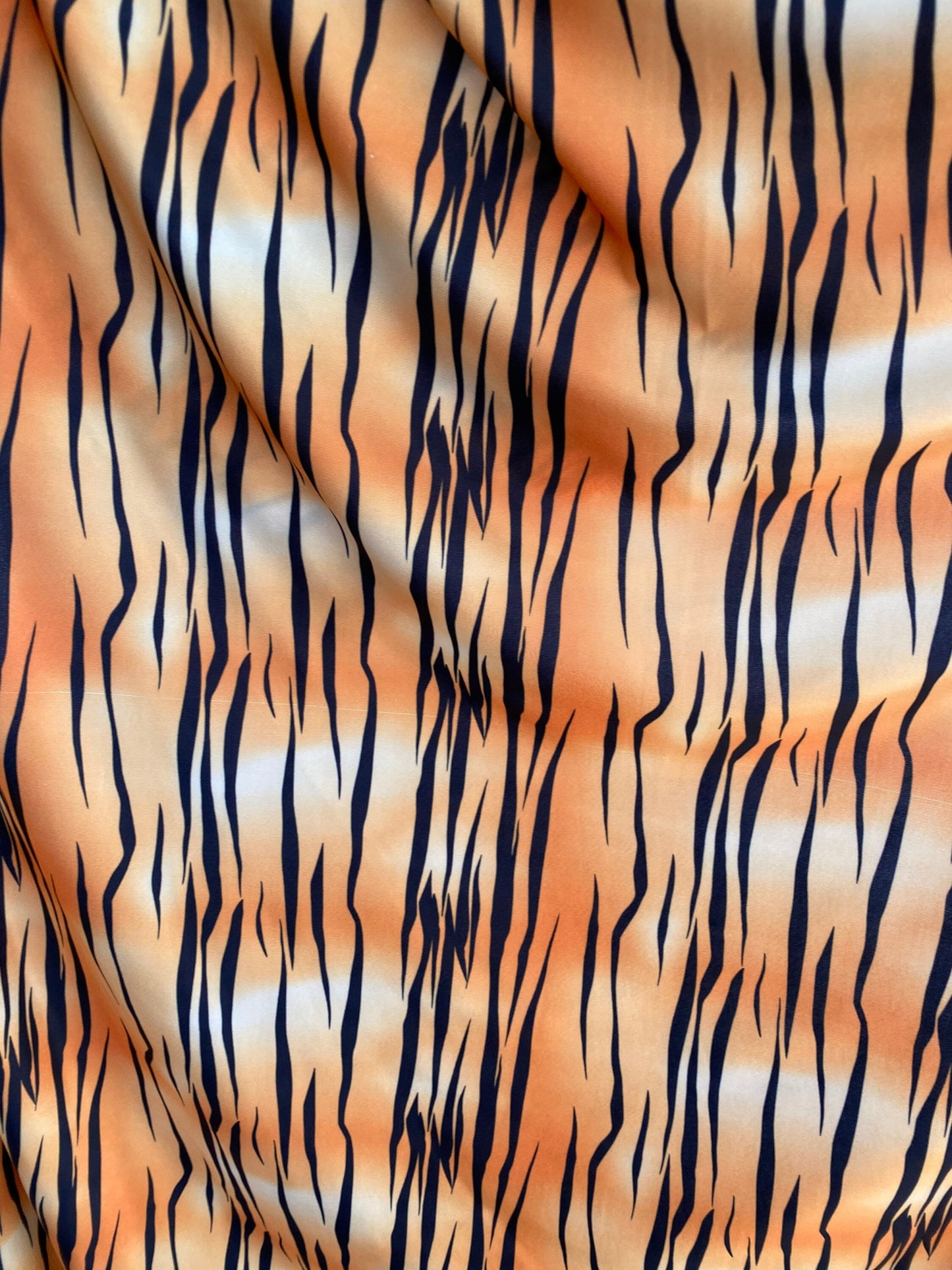 Tiger print design on poly spandex light weight 4-way stretch 58/60” Sold by the YD. Ships worldwide from Los Angeles California USA.