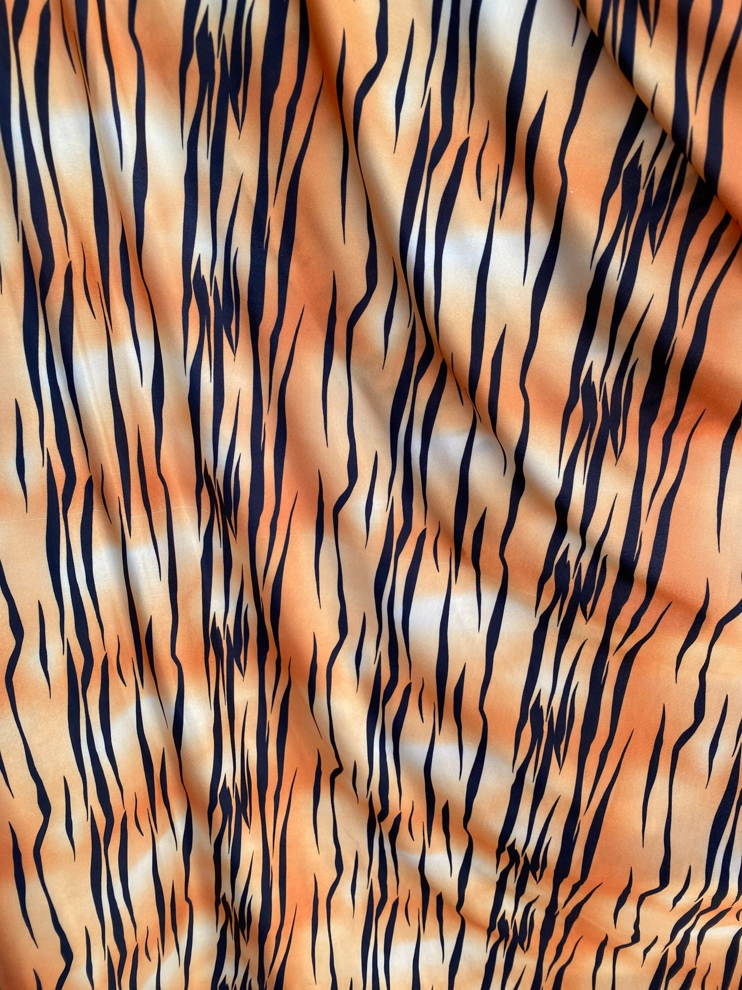 Tiger print design on poly spandex light weight 4-way stretch 58/60” Sold by the YD. Ships worldwide from Los Angeles California USA.