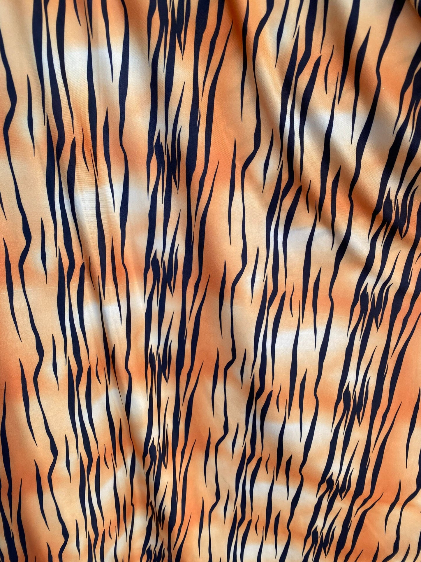 Tiger print design on poly spandex light weight 4-way stretch 58/60” Sold by the YD. Ships worldwide from Los Angeles California USA.