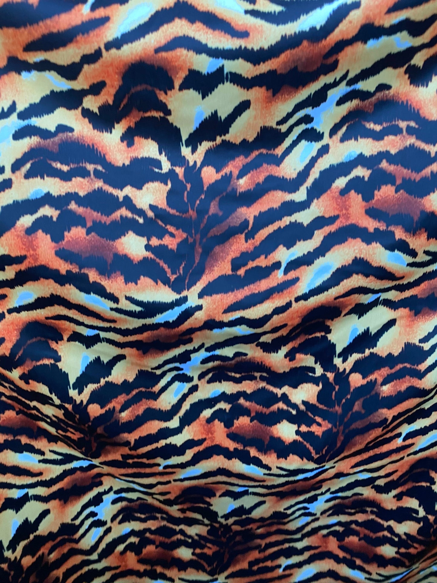 Tiger design exotic animal print on poly spandex 4-way stretch 58/60” Sold by the YD. Ships worldwide from Los Angeles California USA.