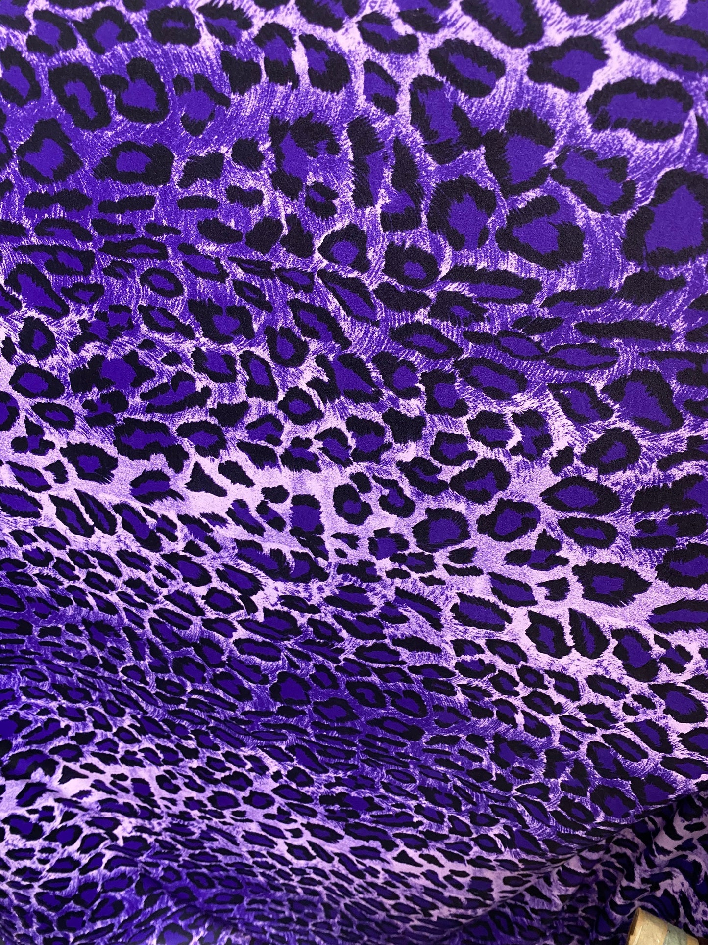 Exotic leopard design purple/black print on nylon spandex 4-way stretch 58/60” Sold by the YD. Ships worldwide from Los Angeles California