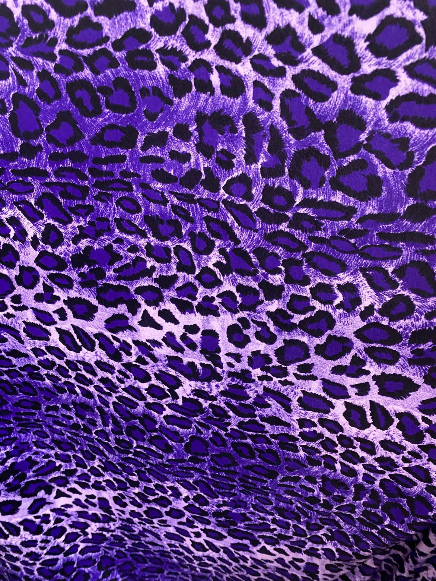 Exotic leopard design purple/black print on nylon spandex 4-way stretch 58/60” Sold by the YD. Ships worldwide from Los Angeles California