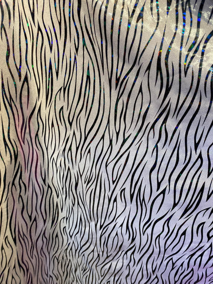 New abstract zebra design hologram foggy foil nylon spandex 4-way stretch 58/60” Sold by the YD. Ships worldwide from Los Angeles California