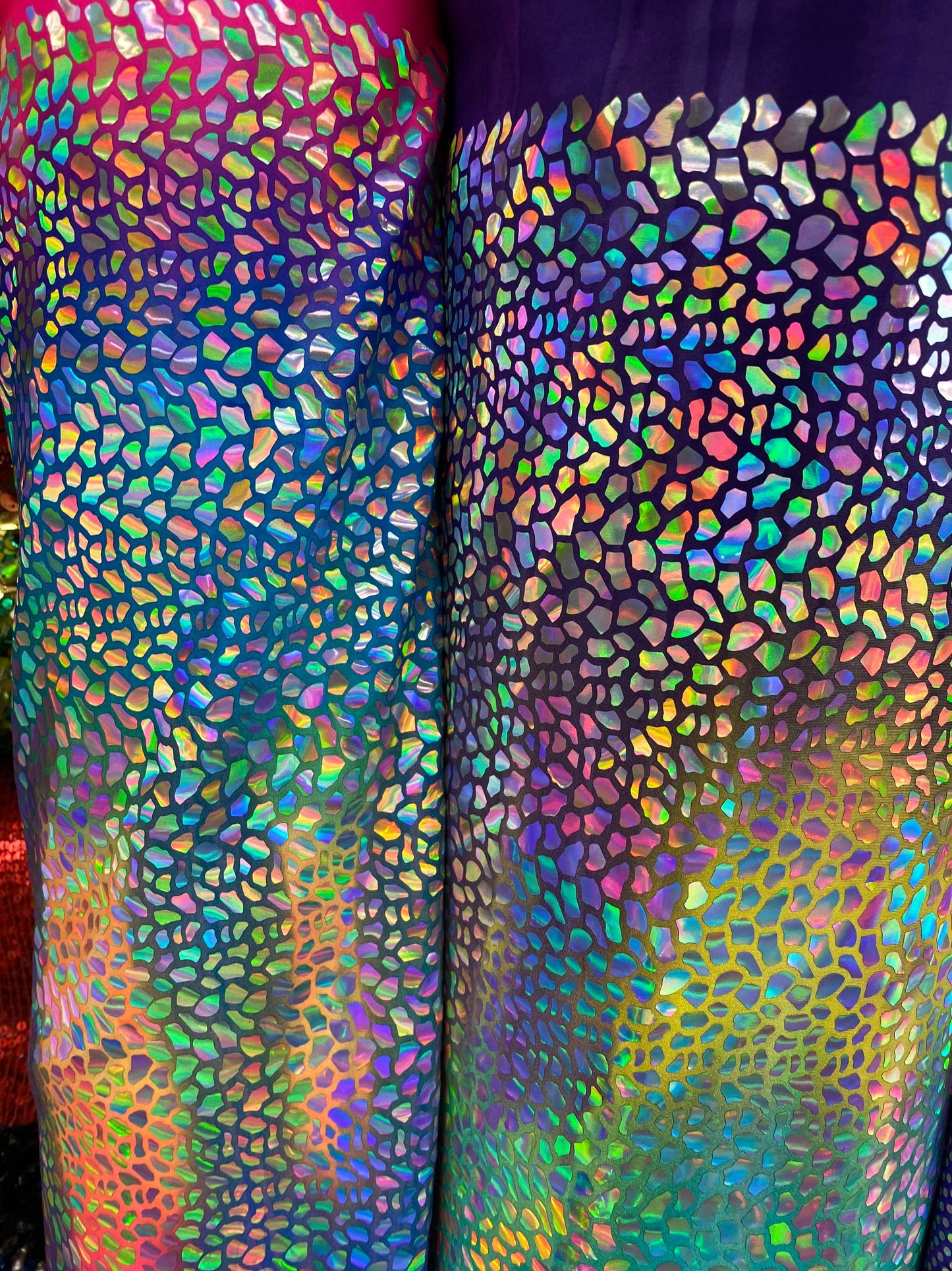 New Dragon scales Iridescent foil on Great tie dye nylon spandex 4-way stretch 58/60” Sold by the YD. New fabric in stock.