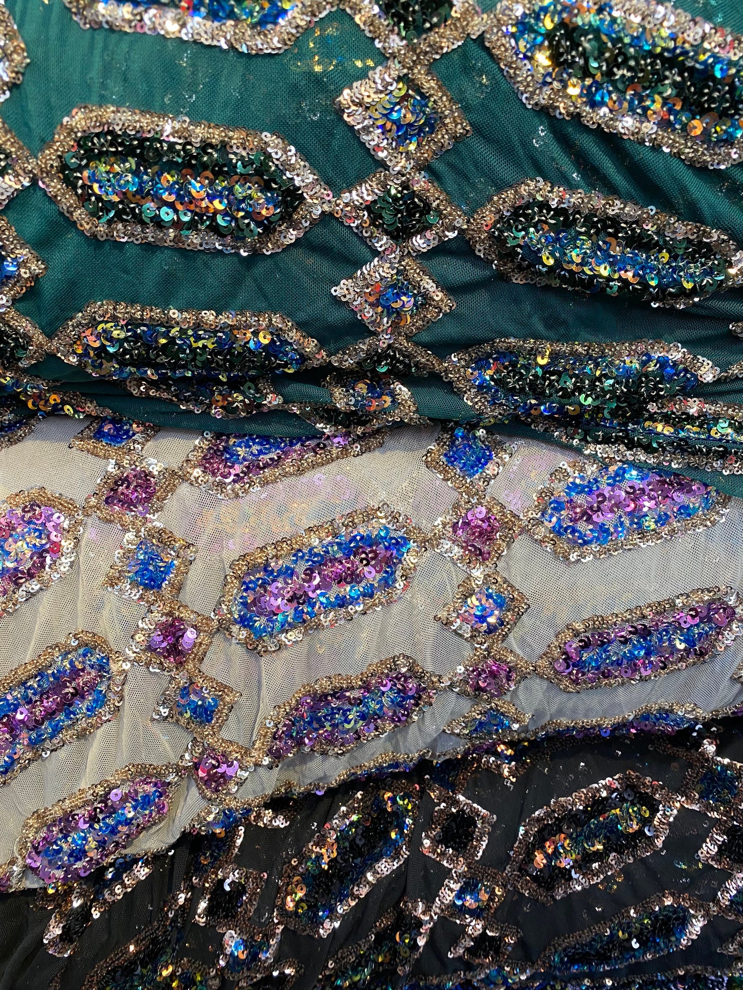 New geometric avatar iridescent sequins on stretch mesh 2-way 50/52” Sold by the YD. Ships worldwide from Los Angeles California USA.