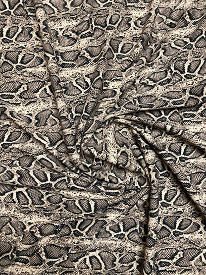 New Exotic snake design taupe/black print on great poly spandex 2-way stretch 58/60” Sold by the YD. Ships worldwide from Los Angeles CA.