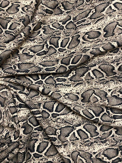 New Exotic snake design taupe/black print on great poly spandex 2-way stretch 58/60” Sold by the YD. Ships worldwide from Los Angeles CA.