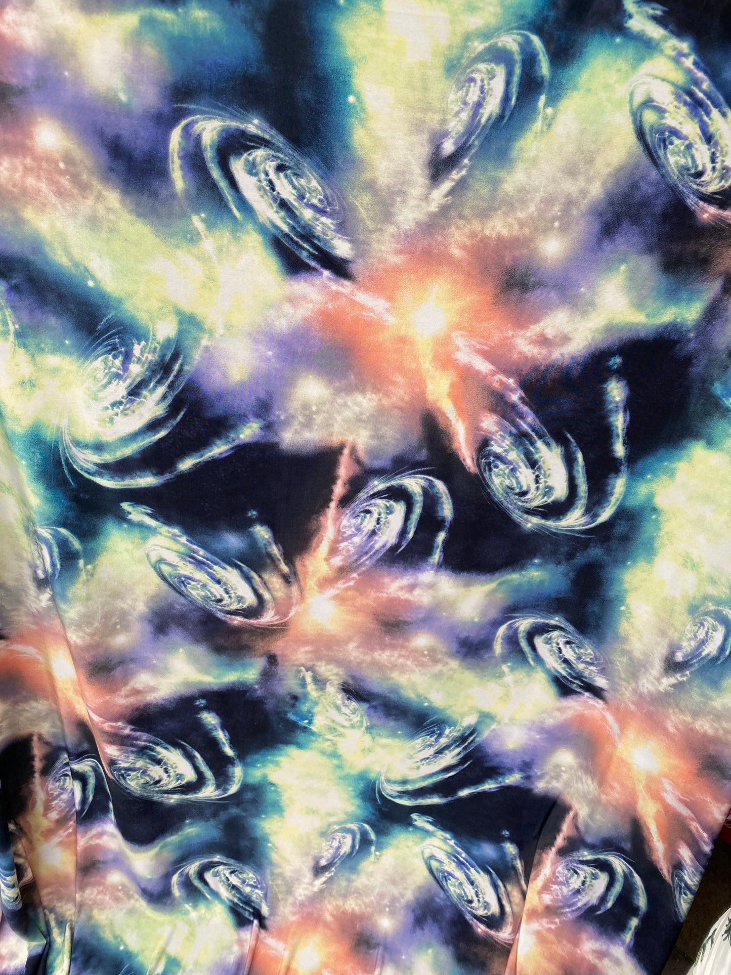 Universe design multicolor print on poly spandex 4-way stretch 58/60” Sold by the YD. Ships worldwide from Los Angeles California USA.