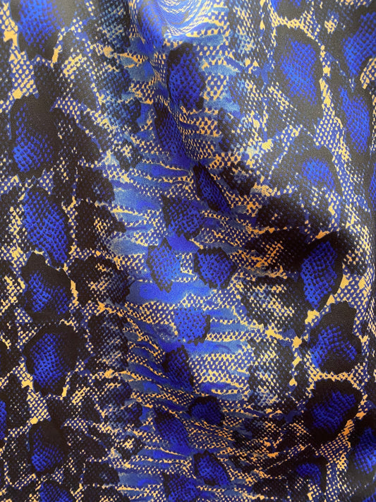 New poly spandex snake design medium weight 2-way stretch taupe/sapphire 58/60” Sold by the YD. Ships worldwide from Los Angeles California