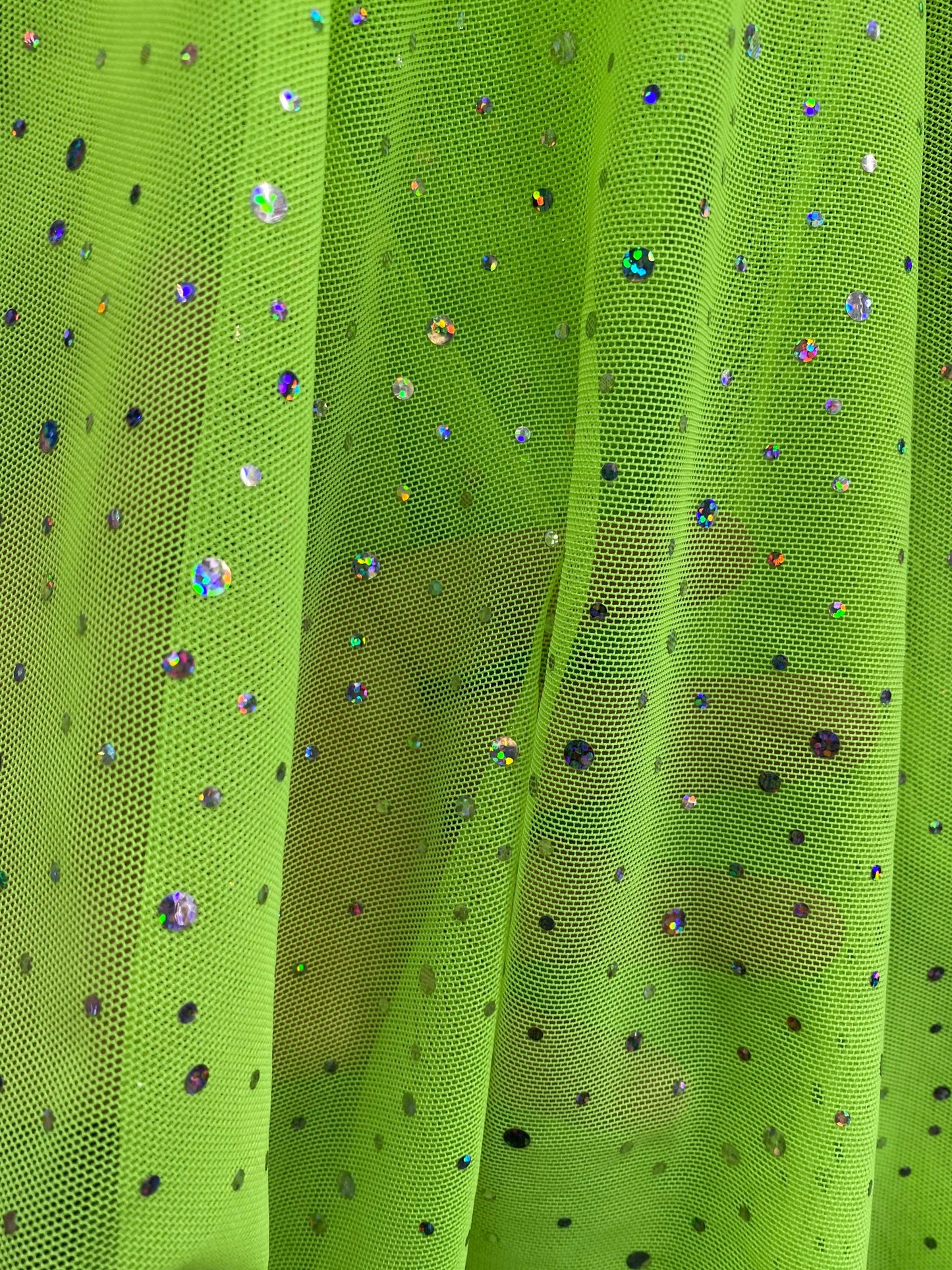 New power mesh neon green with hologram sequins all over 4-way stretch 58/60” Sold by the YD. Ships worldwide from Los Angeles California US