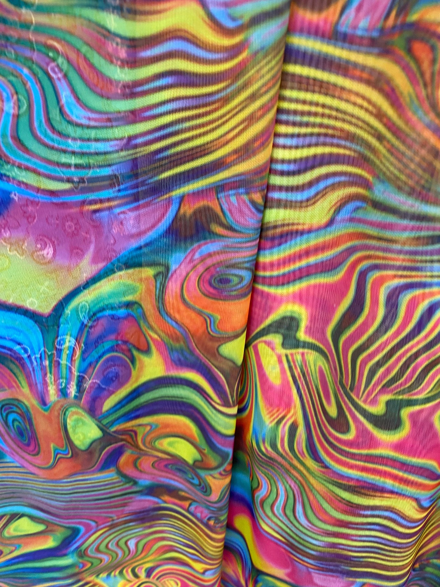 Swirl design multicolor print on power mesh nylon spandex 4-way stretch 58/60” Sold by the YD. Ships worldwide from Los Angeles California