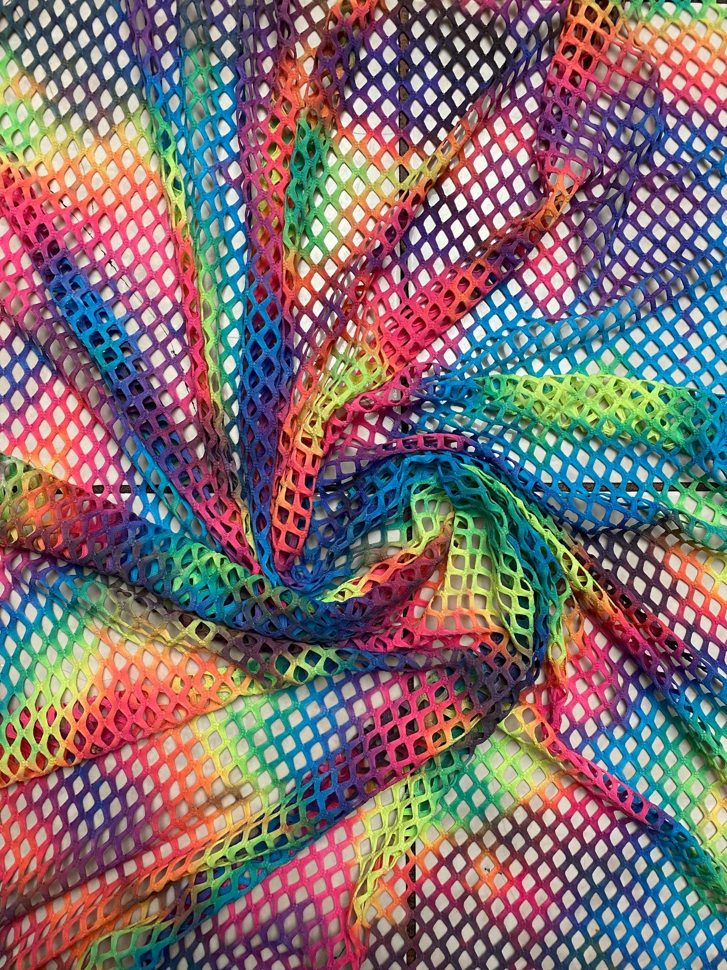 Pastel rainbow fishnet Tie dye Diamond mesh design  4-way  stretch mesh 58/60” Sold by the YD. Ships worldwide from Los Angeles