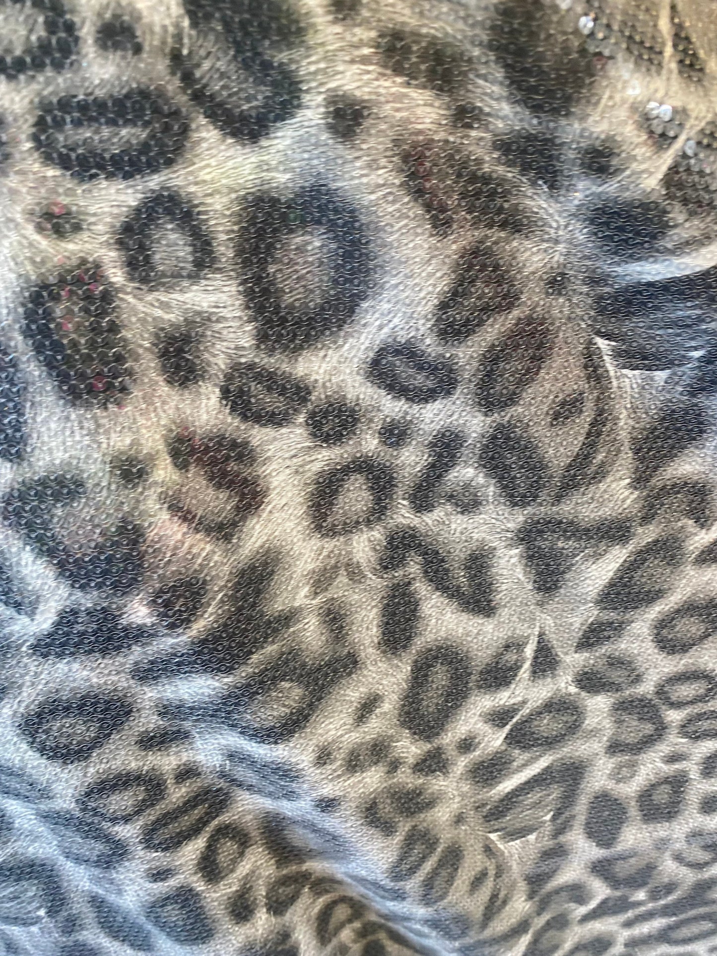 New Exotic leopard design with clear sequins all over lycra base 2-way stretch 58/60” Sold by the YD. Ships worldwide from Los Angeles cali