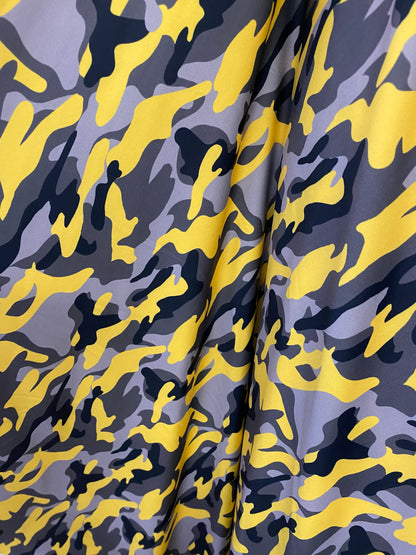 New modern camouflage yellow/black/gray print on great quality of nylon spandex 4-way stretch 58/60” Sold by the YD.