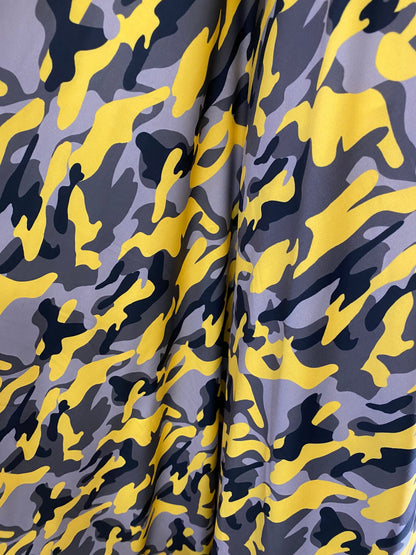 New modern camouflage yellow/black/gray print on great quality of nylon spandex 4-way stretch 58/60” Sold by the YD.