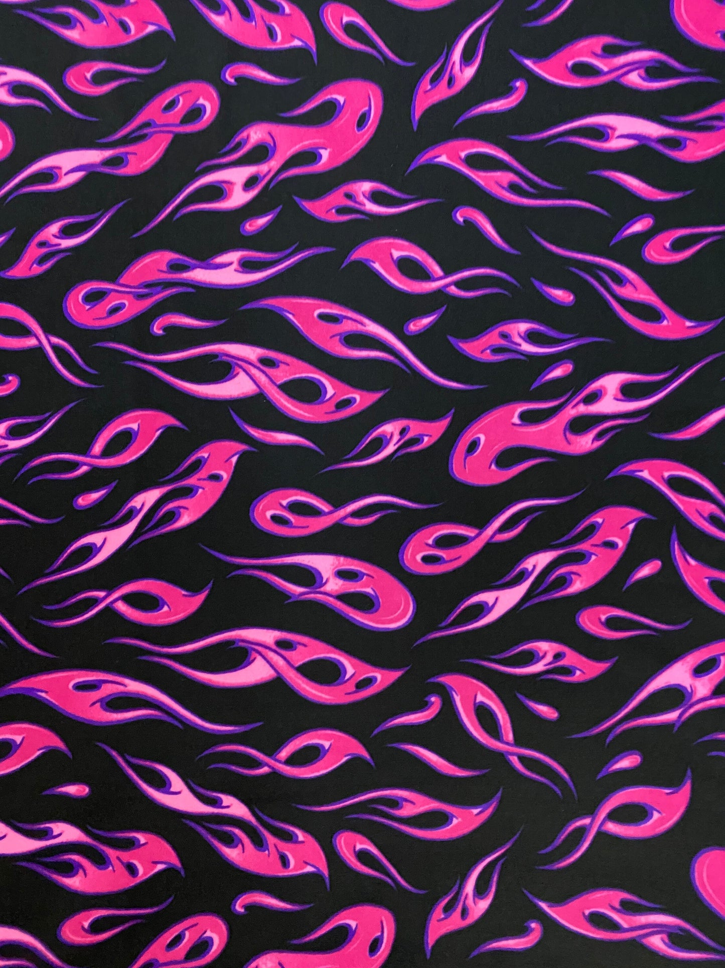 New modern hot flames design it glows in the dark with a black light print on best quality of nylon spandex 4-way stretch 58/60”