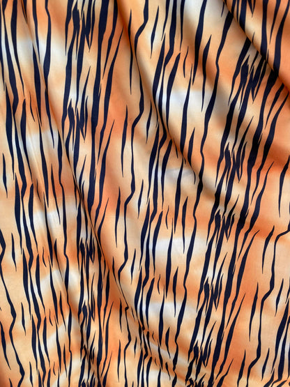 Tiger print design on poly spandex light weight 4-way stretch 58/60” Sold by the YD. Ships worldwide from Los Angeles California USA.