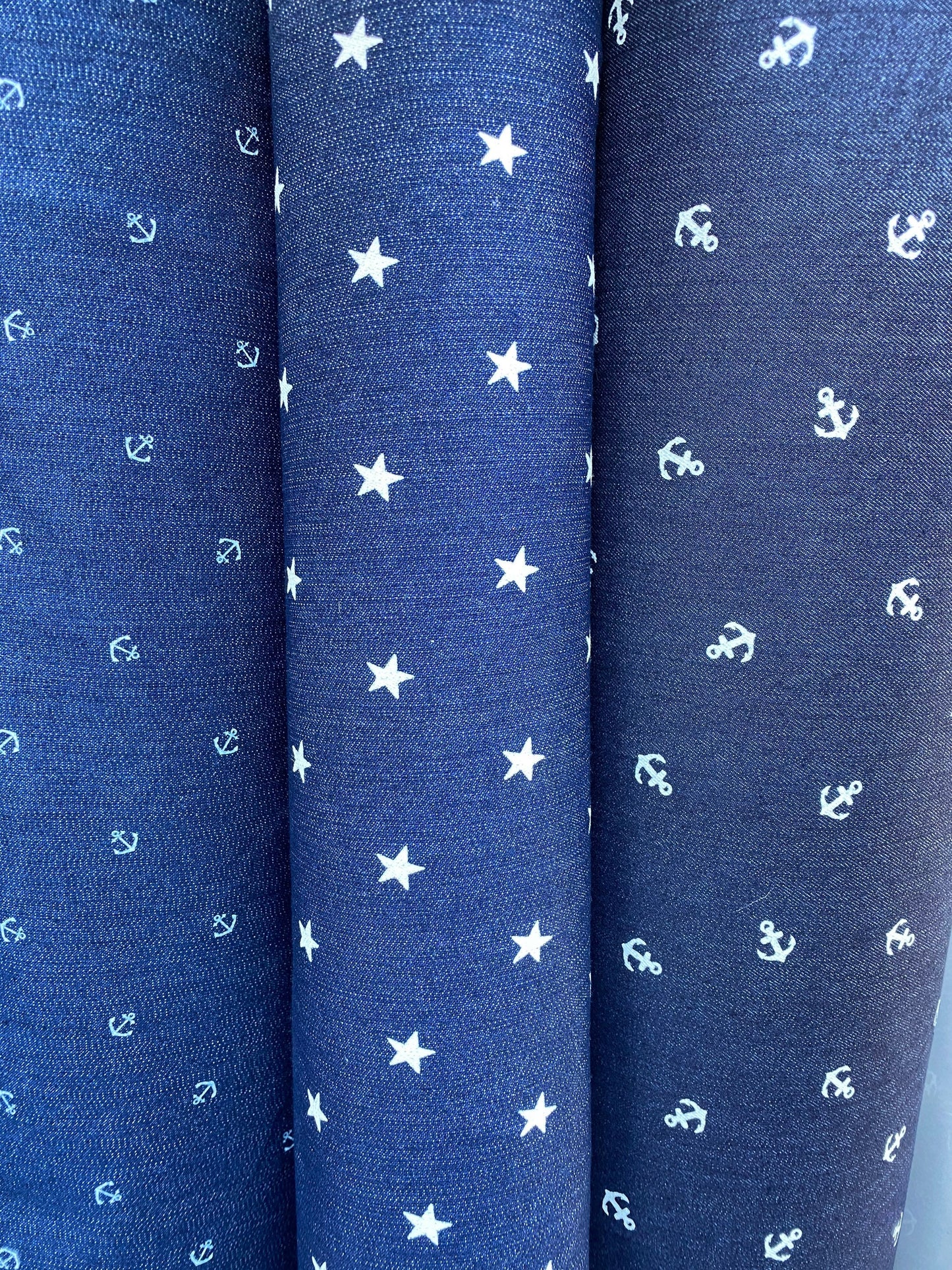 New stretch denim anchor design and stars design 2-way stretch 54/55” Sold by the YD. Ships worldwide from Los Angeles California USA.