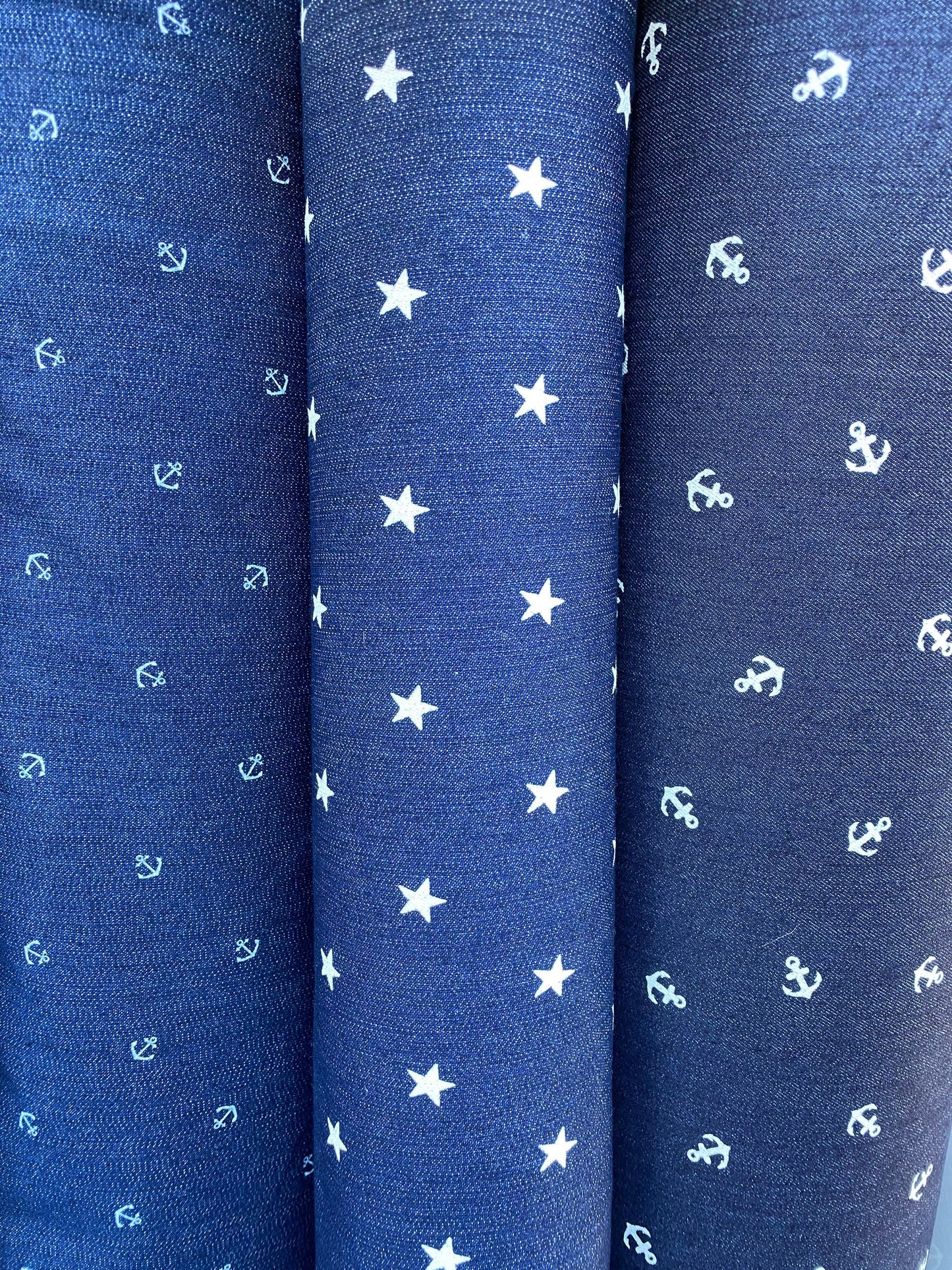 New stretch denim anchor design and stars design 2-way stretch 54/55” Sold by the YD. Ships worldwide from Los Angeles California USA.