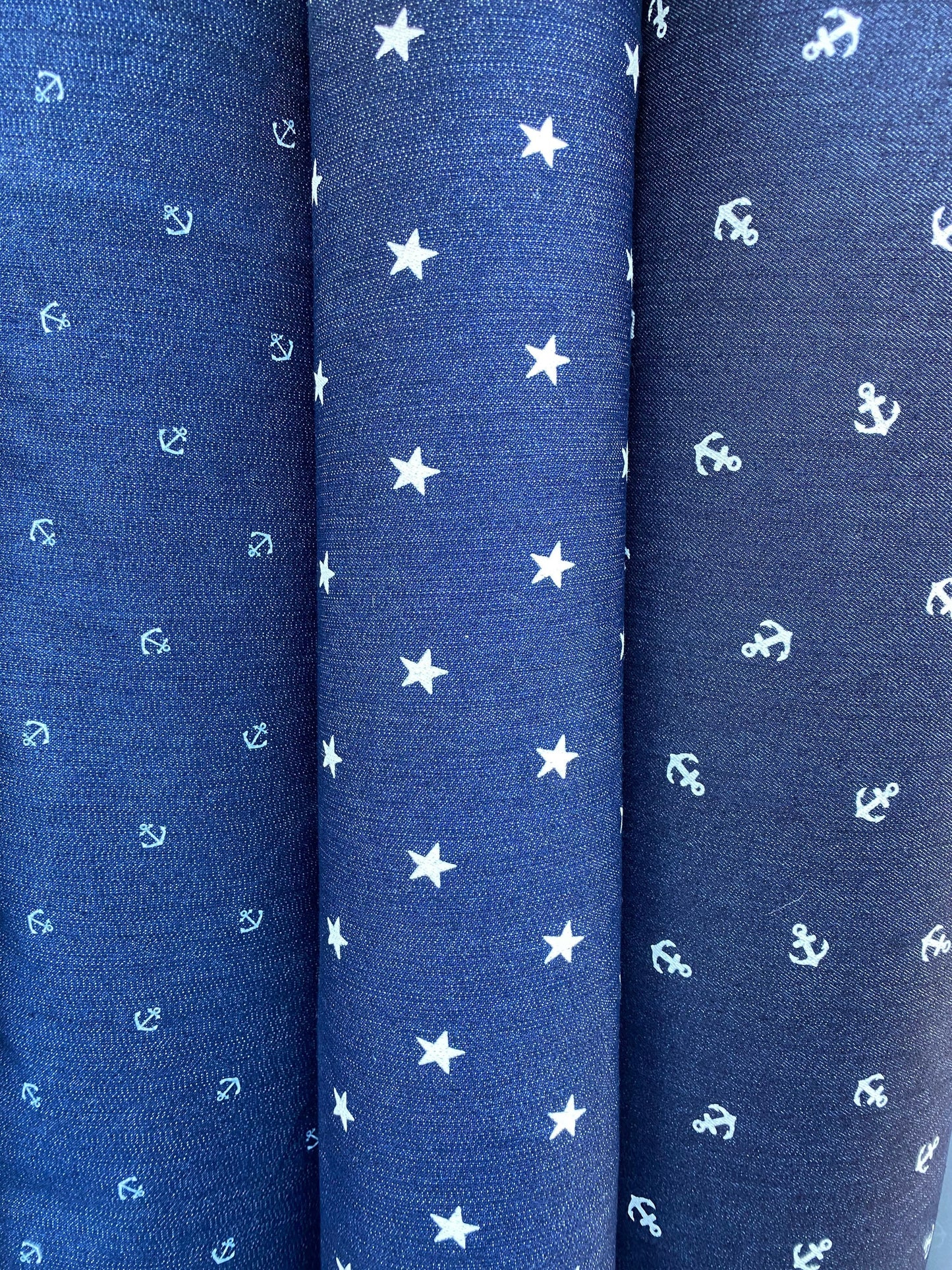 New stretch denim anchor design and stars design 2-way stretch 54/55” Sold by the YD. Ships worldwide from Los Angeles California USA.