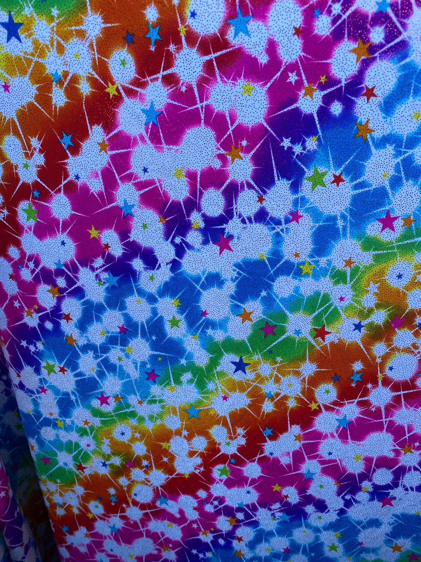 New stars design print on nylon spandex with foil 4-way stretch 58/60” Sold by the YD. Ships worldwide from Los Angeles California USA.