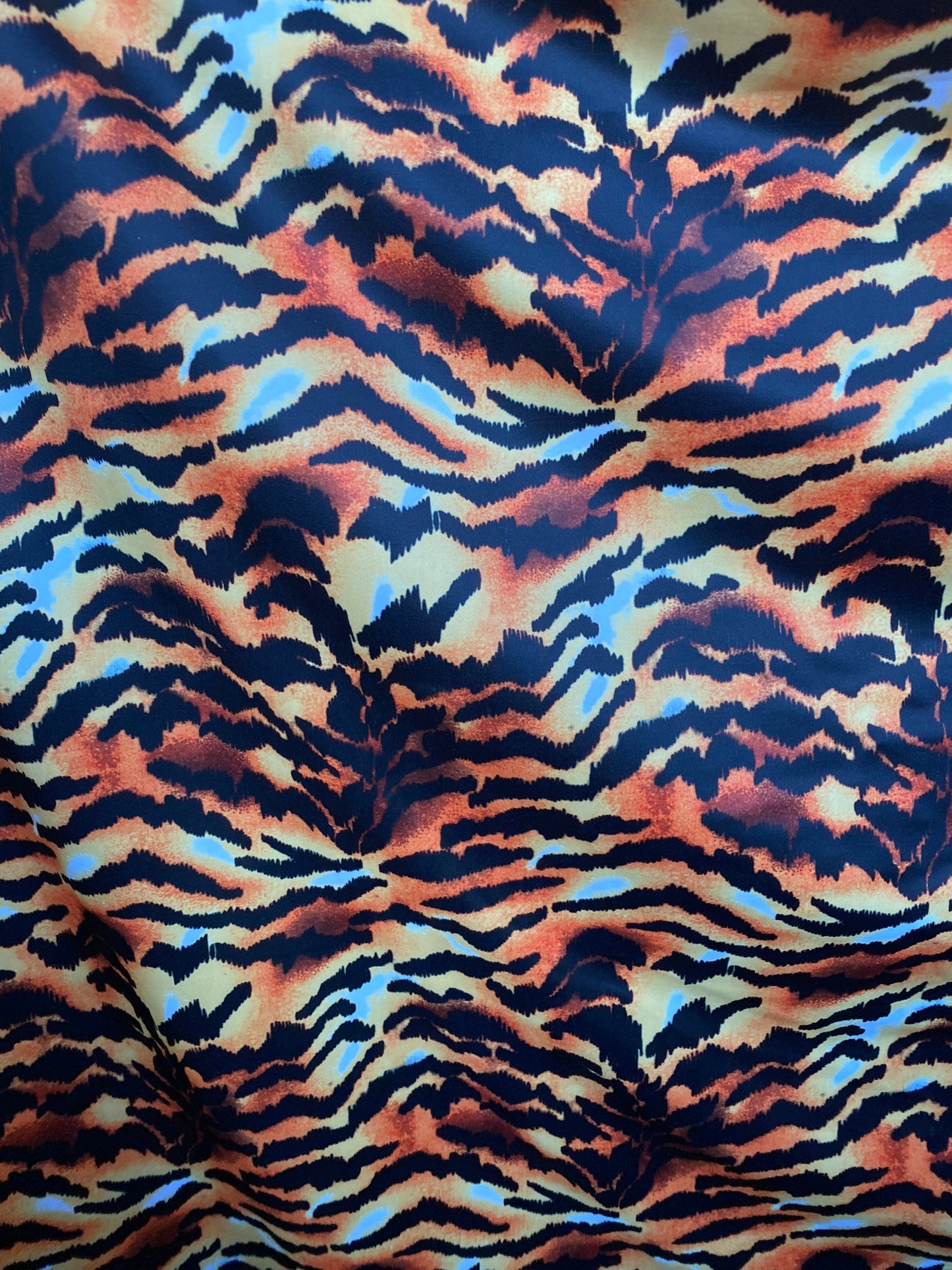 Tiger design exotic animal print on poly spandex 4-way stretch 58/60” Sold by the YD. Ships worldwide from Los Angeles California USA.