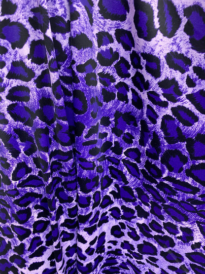 Exotic leopard design purple/black print on nylon spandex 4-way stretch 58/60” Sold by the YD. Ships worldwide from Los Angeles California