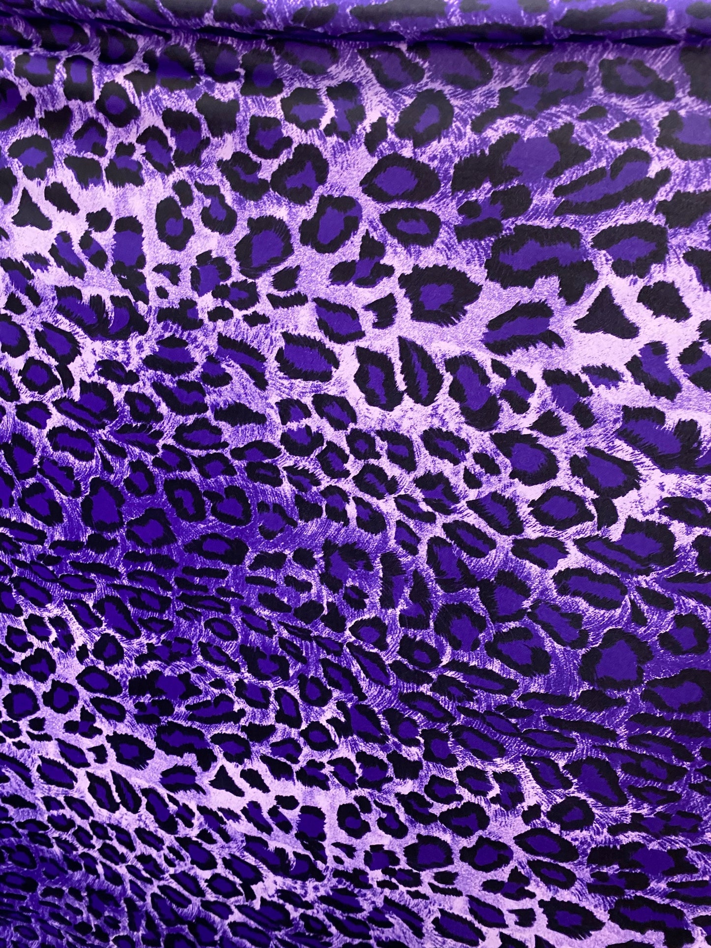 Exotic leopard design purple/black print on nylon spandex 4-way stretch 58/60” Sold by the YD. Ships worldwide from Los Angeles California