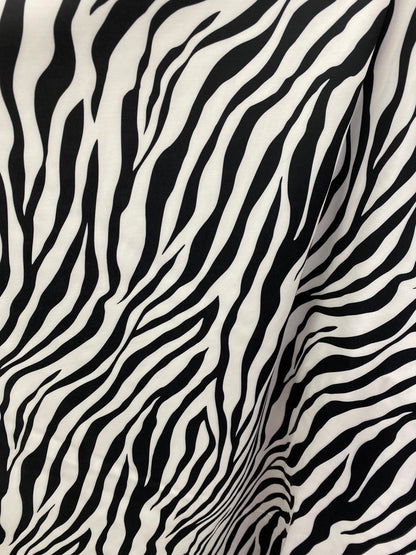 New exotic zebra design print on nylon spandex 4-way Stretch 58/60” Sold by the YD. Ships worldwide from Los Angeles California USA.