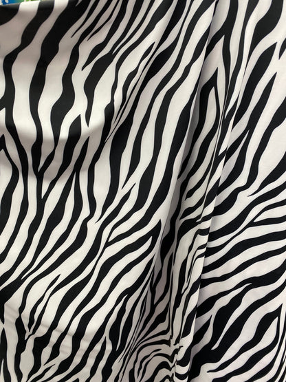 New exotic zebra design print on nylon spandex 4-way Stretch 58/60” Sold by the YD. Ships worldwide from Los Angeles California USA.