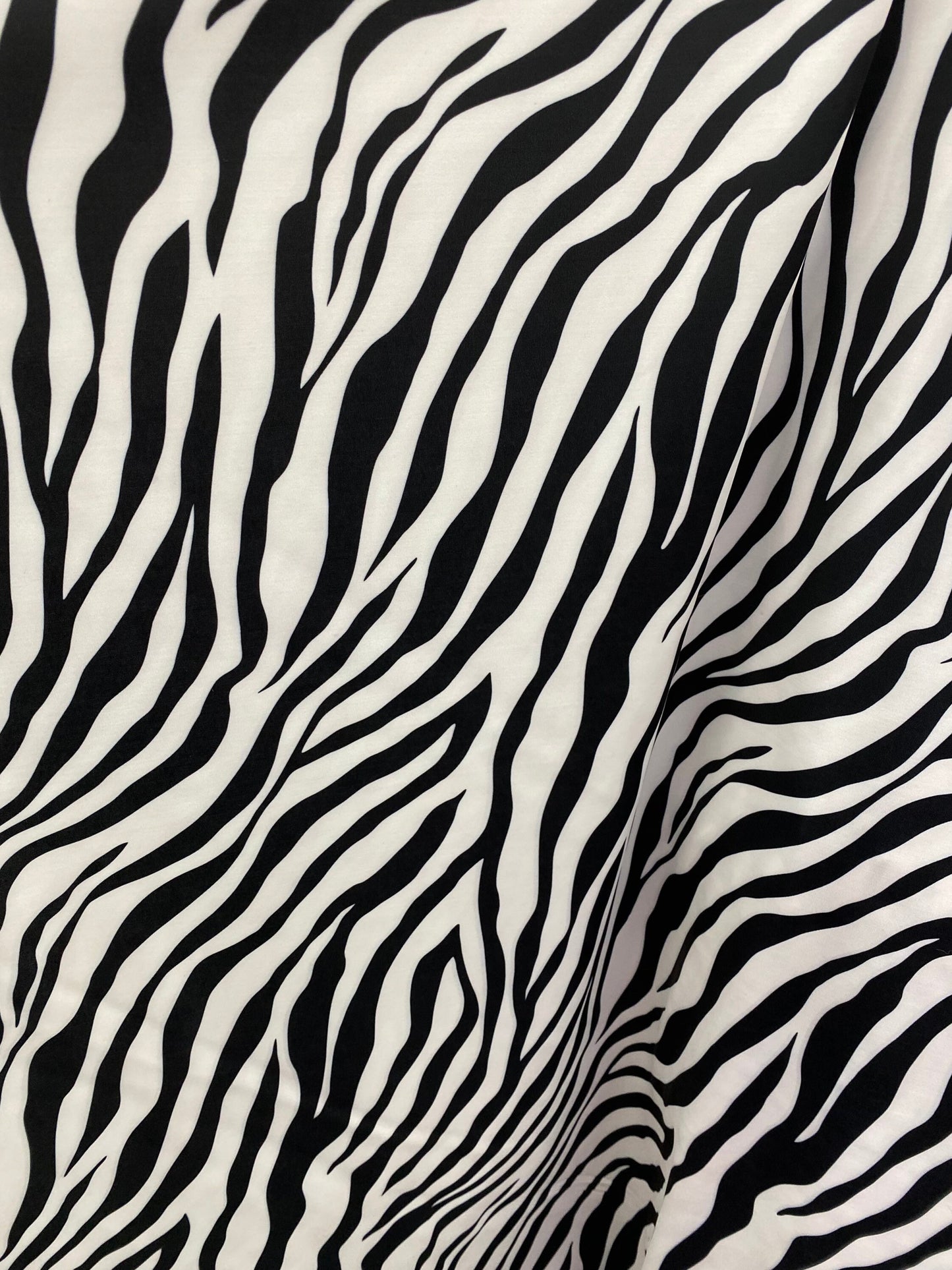 New exotic zebra design print on nylon spandex 4-way Stretch 58/60” Sold by the YD. Ships worldwide from Los Angeles California USA.