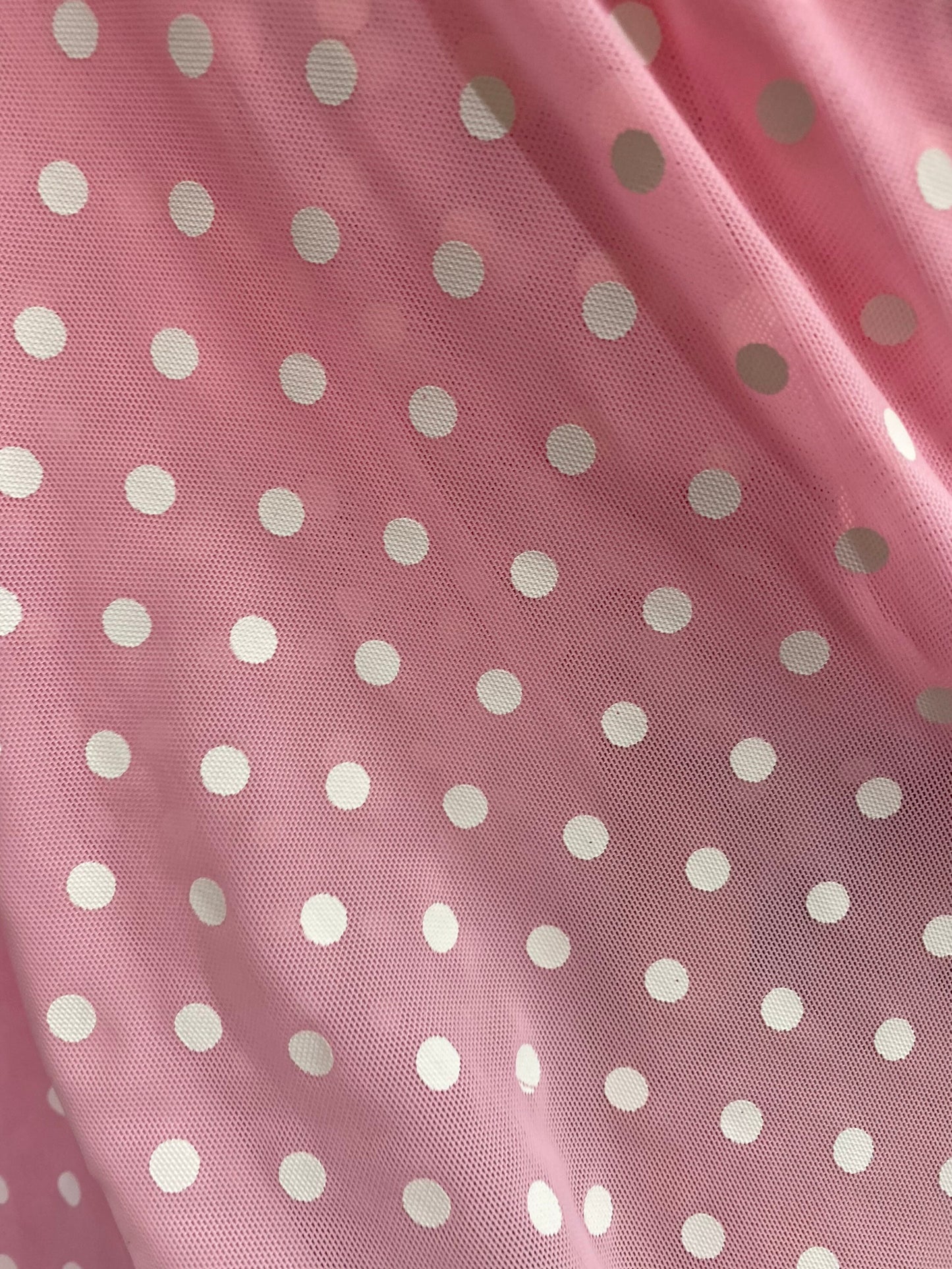 New polka dots design print on power mesh 4-way stretch pink/white 58/60” Sold by the YD. Ships worldwide from Los Angeles California USA.