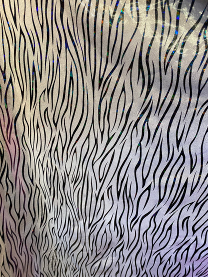 New abstract zebra design hologram foggy foil nylon spandex 4-way stretch 58/60” Sold by the YD. Ships worldwide from Los Angeles California