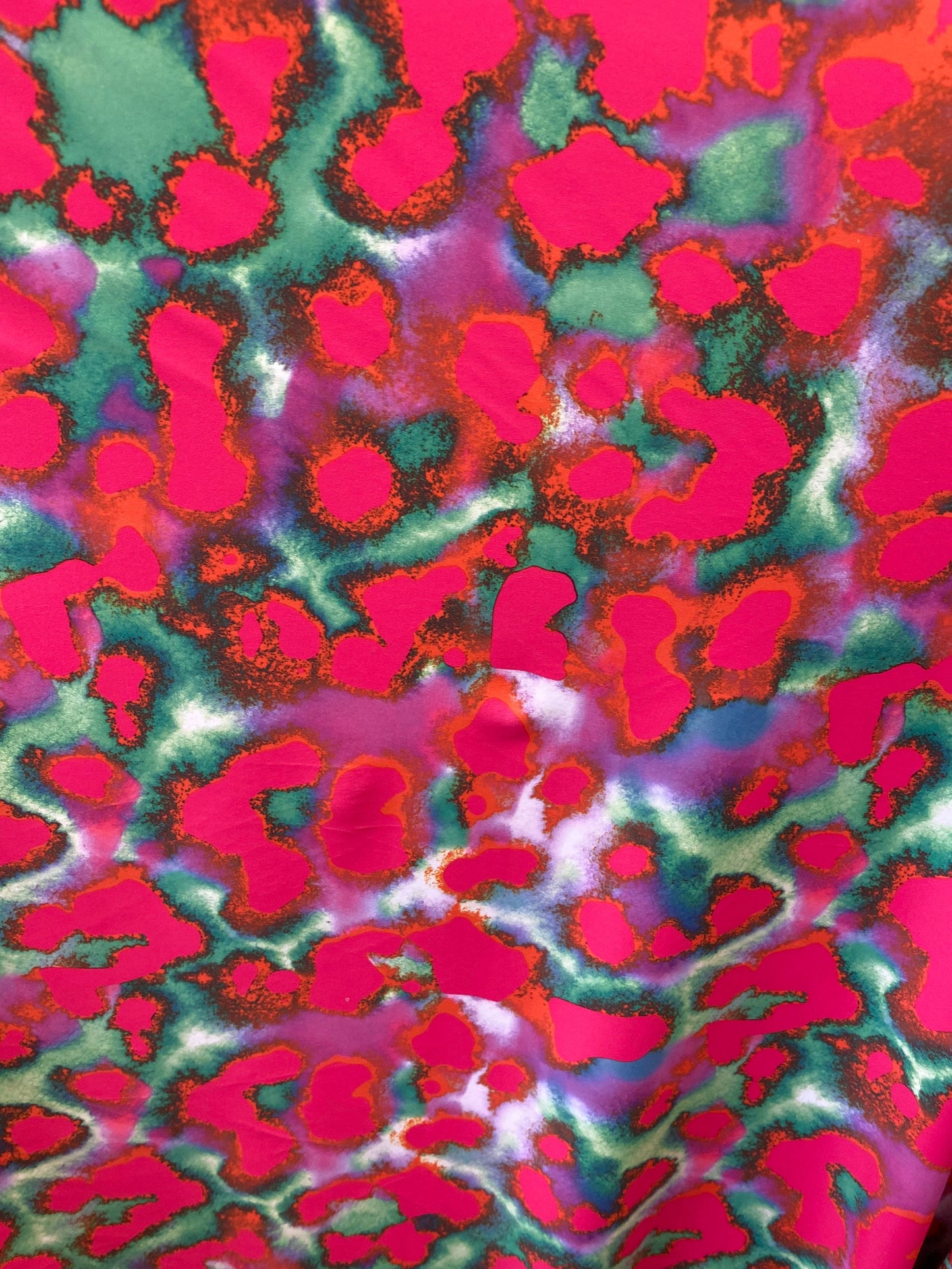 New lava design red/pink/ green print on best quality of nylon spandex 4-way stretch 58/60” Sold by the YD. Ships Worldwide from Los Angeles