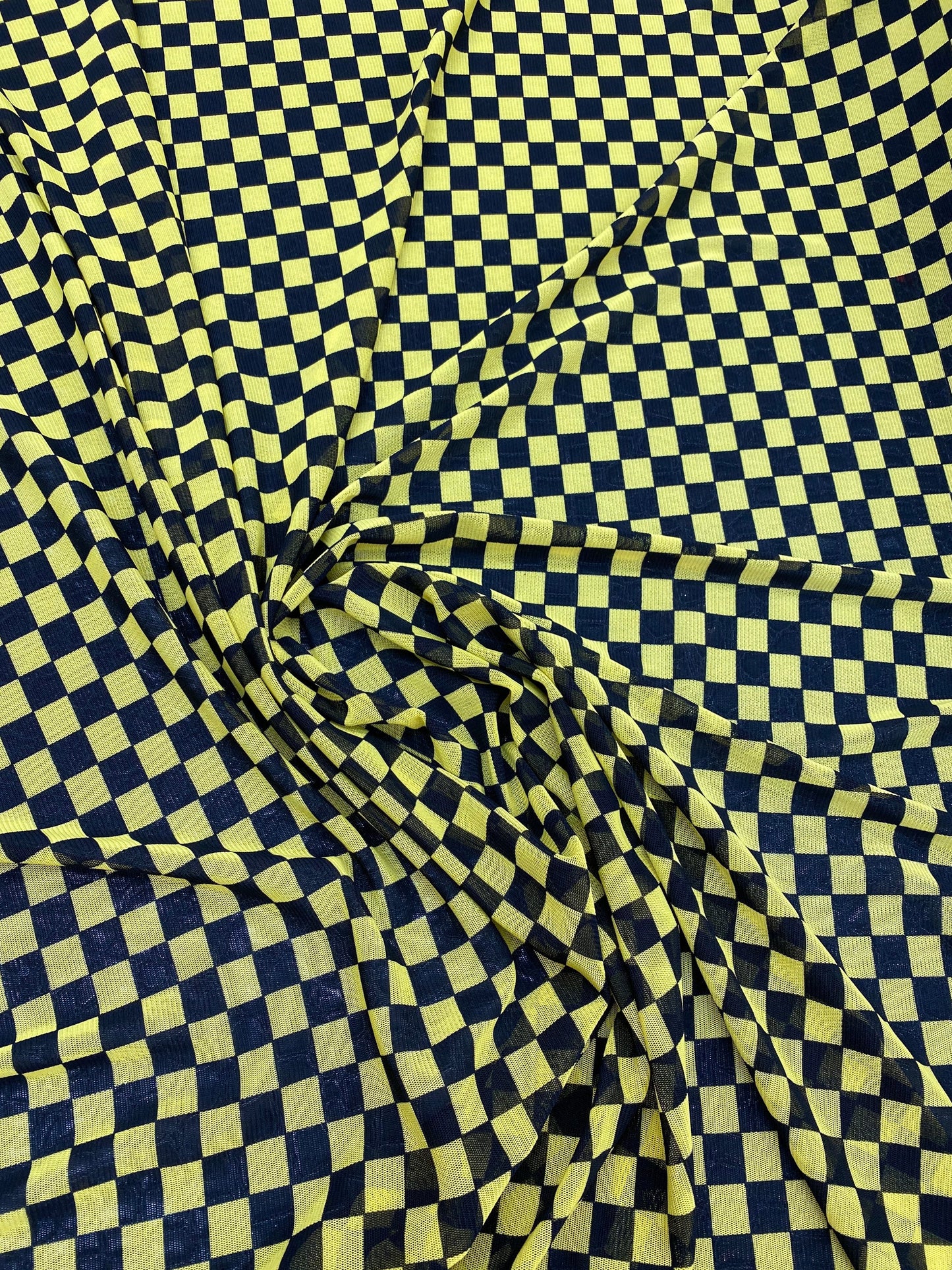 New small Checkered design yellow/black print on power mesh 4-way stretch 58/60” Sold by the YD. Ships worldwide from Los Angeles California