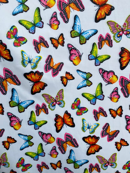 Butterfly design white/rainbow multicolor print on great quality of nylon spandex 4-way stretch 58/)0” Sold by the YD. Ships Worldwide