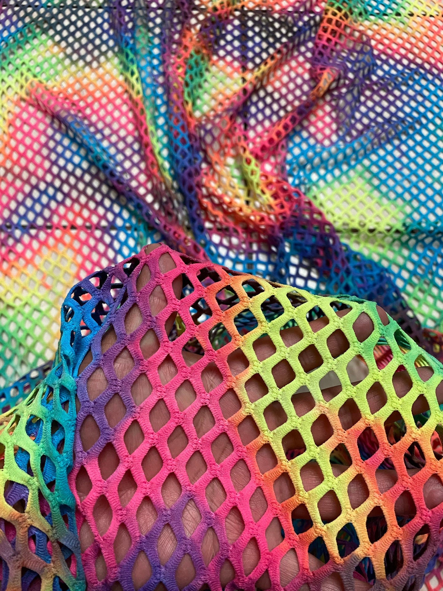 Pastel rainbow fishnet Tie dye Diamond mesh design  4-way  stretch mesh 58/60” Sold by the YD. Ships worldwide from Los Angeles