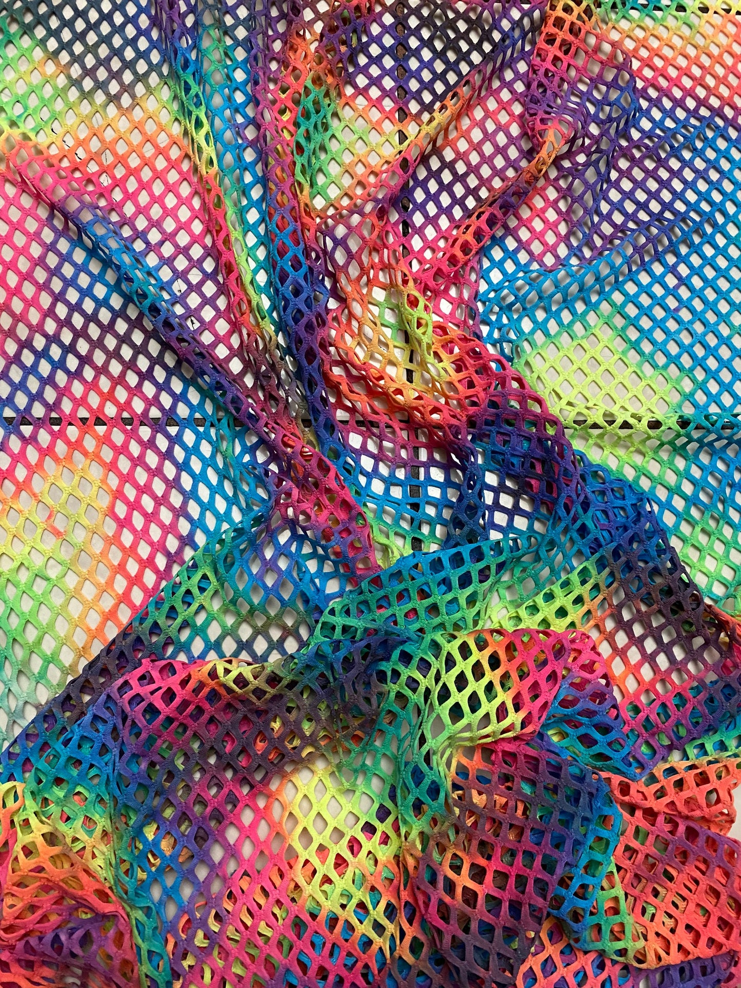 Pastel rainbow fishnet Tie dye Diamond mesh design  4-way  stretch mesh 58/60” Sold by the YD. Ships worldwide from Los Angeles