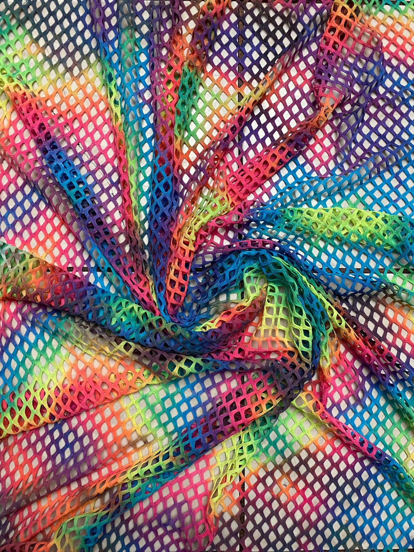 Pastel rainbow fishnet Tie dye Diamond mesh design  4-way  stretch mesh 58/60” Sold by the YD. Ships worldwide from Los Angeles