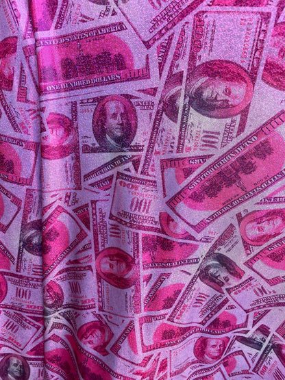 New metallic nylon spandex money design 100 dollar bill pink/green print on 4-way spandex with foggy foil all over 58/60” Sold by the YD.