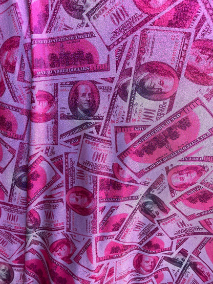 New metallic nylon spandex money design 100 dollar bill pink/green print on 4-way spandex with foggy foil all over 58/60” Sold by the YD.