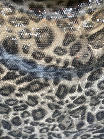 New Exotic leopard design with clear sequins all over lycra base 2-way stretch 58/60” Sold by the YD. Ships worldwide from Los Angeles cali