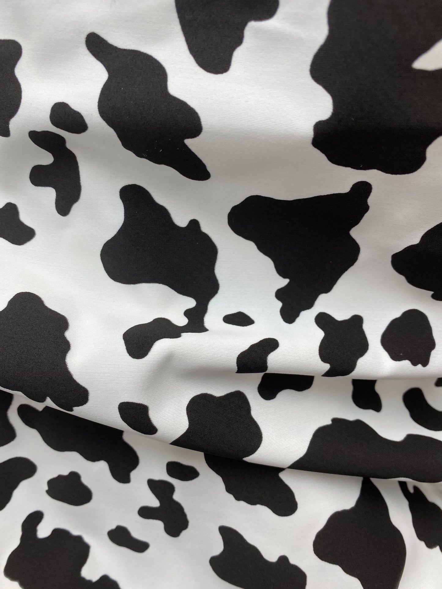 New Cow design print on great quality of nylon spandex 4-way stretch 58/60” Sold by the YD. Ships worldwide from Los Angeles California USA.