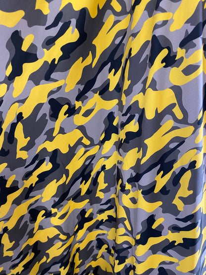 New modern camouflage yellow/black/gray print on great quality of nylon spandex 4-way stretch 58/60” Sold by the YD.