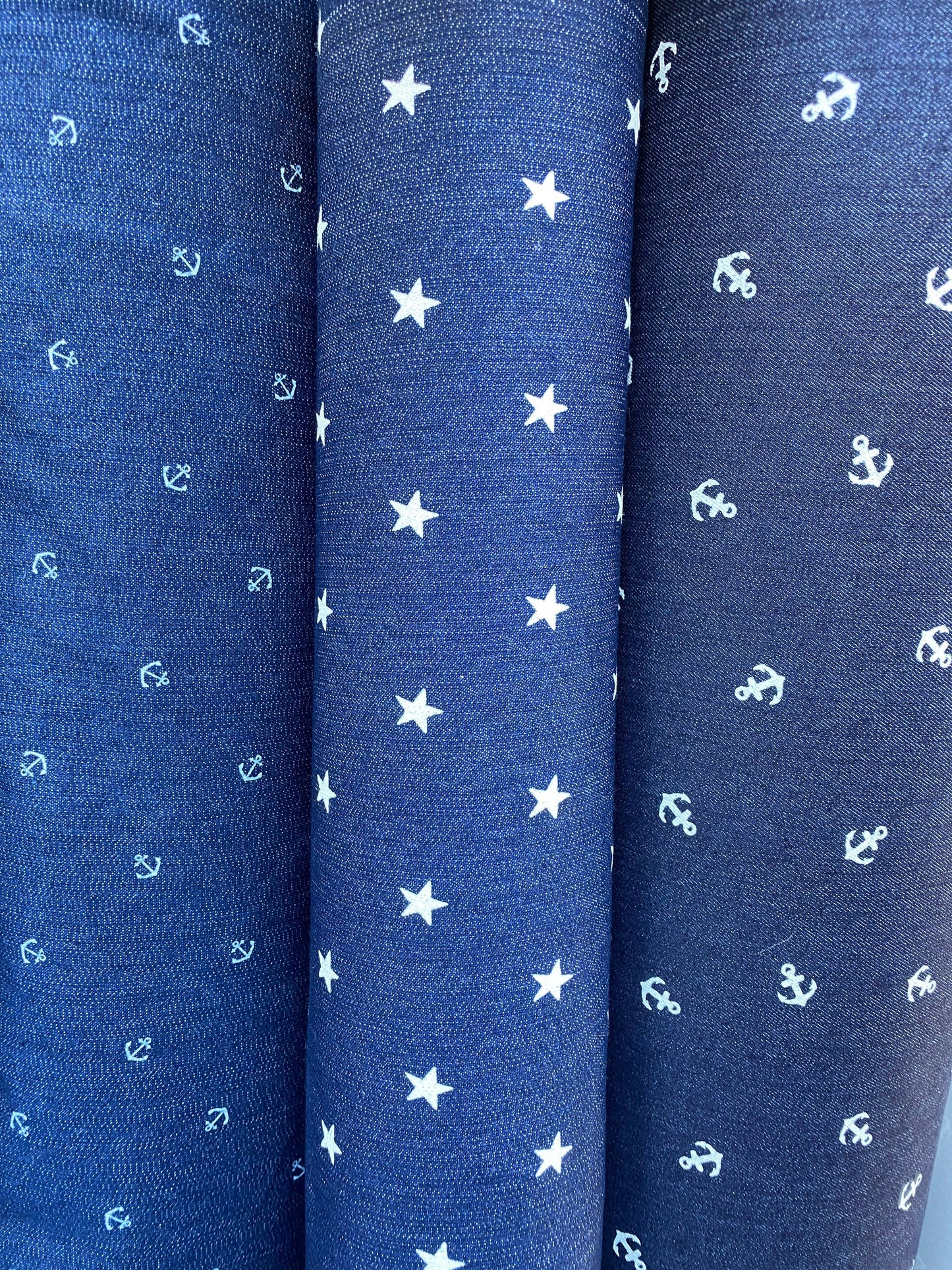 New stretch denim anchor design and stars design 2-way stretch 54/55” Sold by the YD. Ships worldwide from Los Angeles California USA.