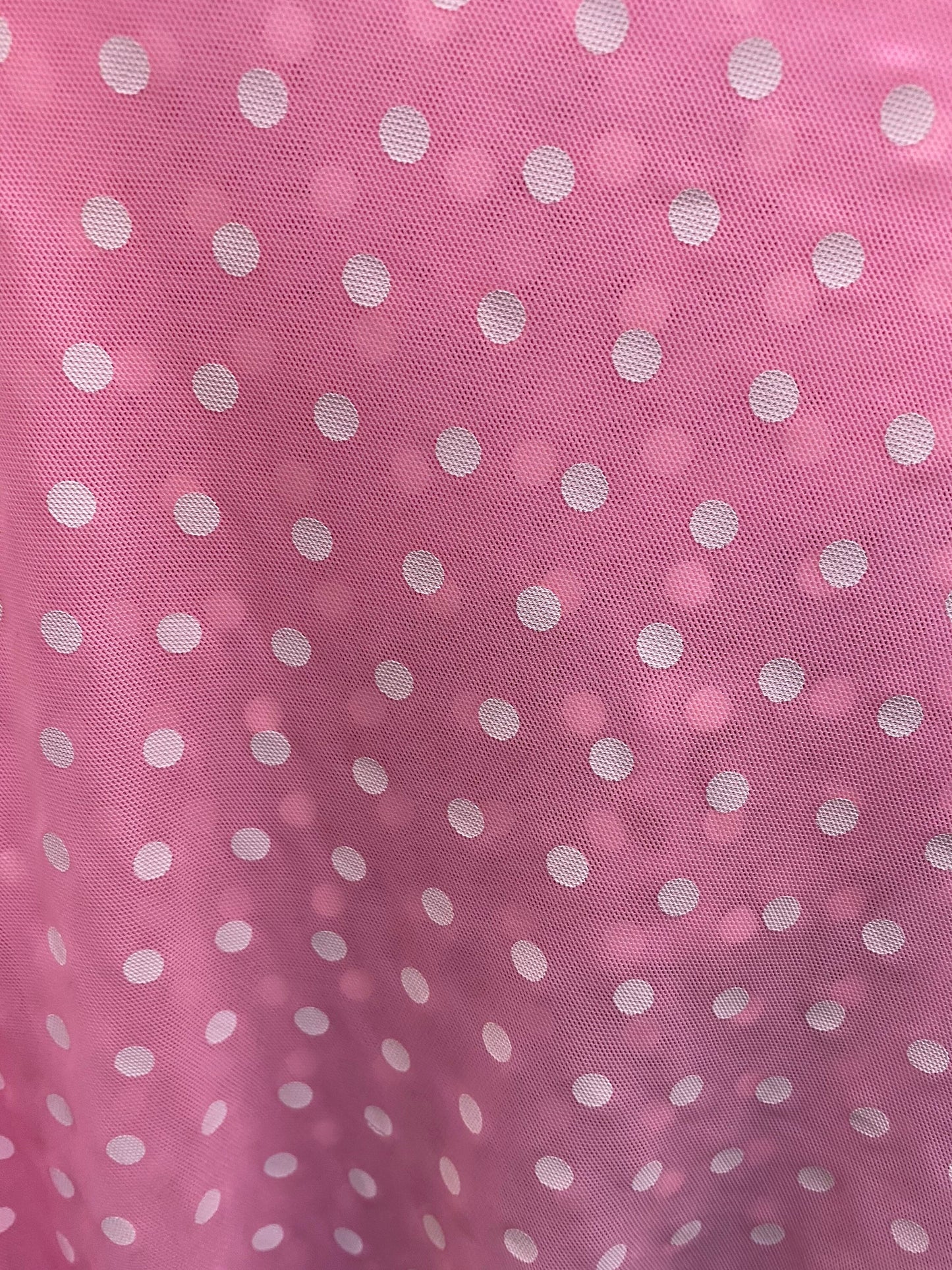 New polka dots design print on power mesh 4-way stretch pink/white 58/60” Sold by the YD. Ships worldwide from Los Angeles California USA.