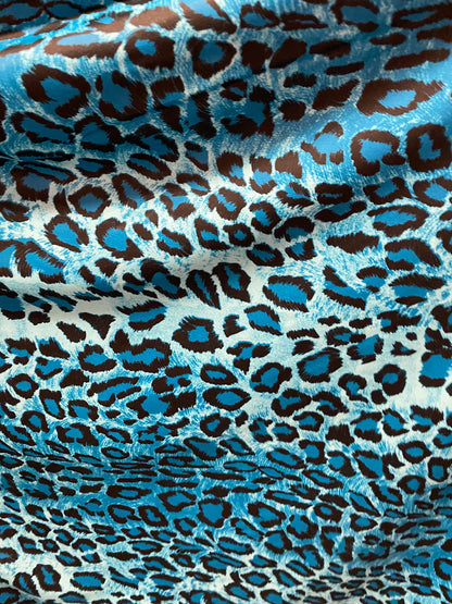 Exotic leopard design Teal/Blue/black print on nylon spandex 4-way stretch 58/60” Sold by the YD. Ships worldwide from Los Angeles Californi