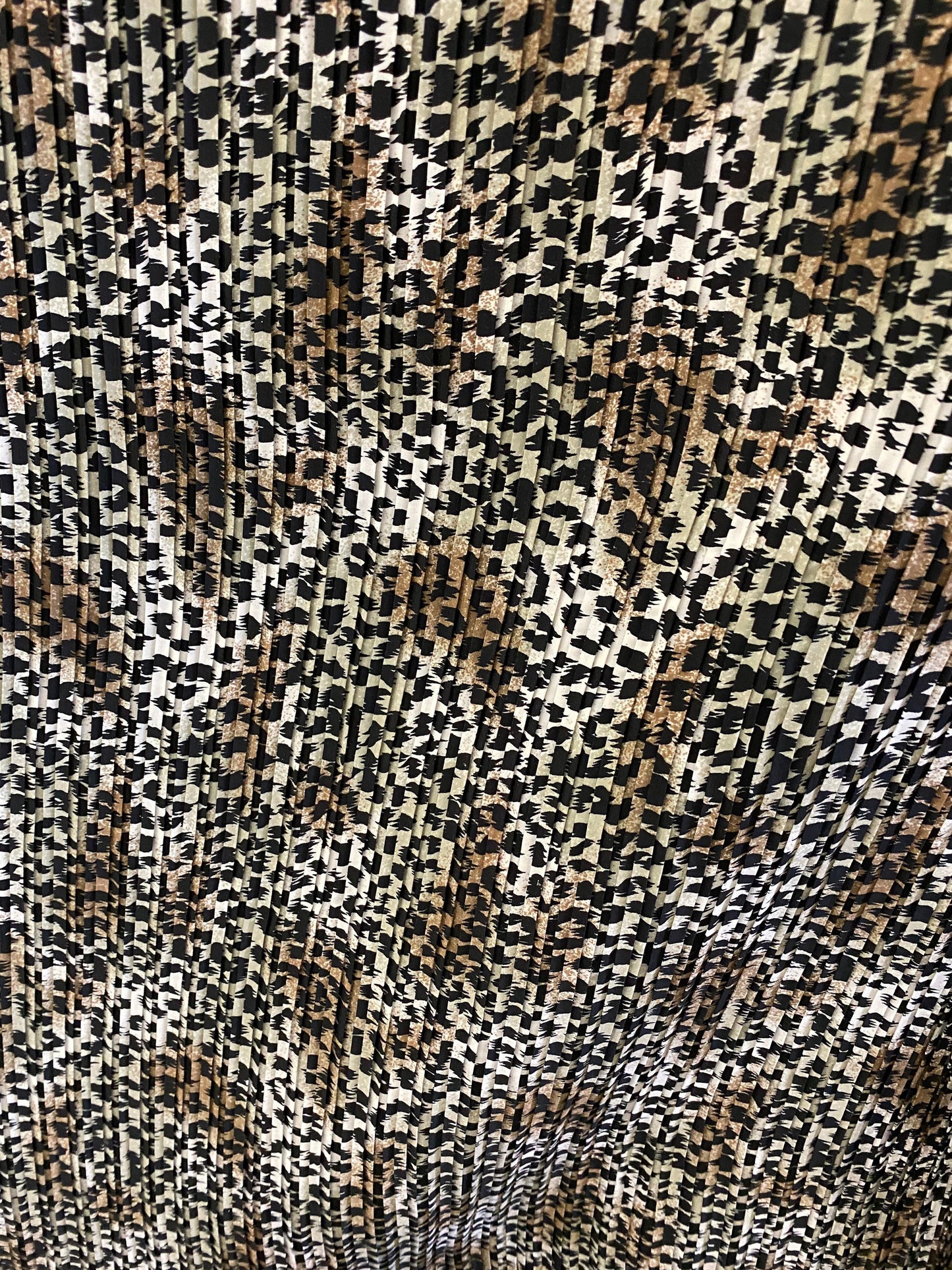 Exotic animal print leopard design print on pleated poly satin fabric 44/45” Sold by the YD. Ships Worldwide from Los Angeles California USA