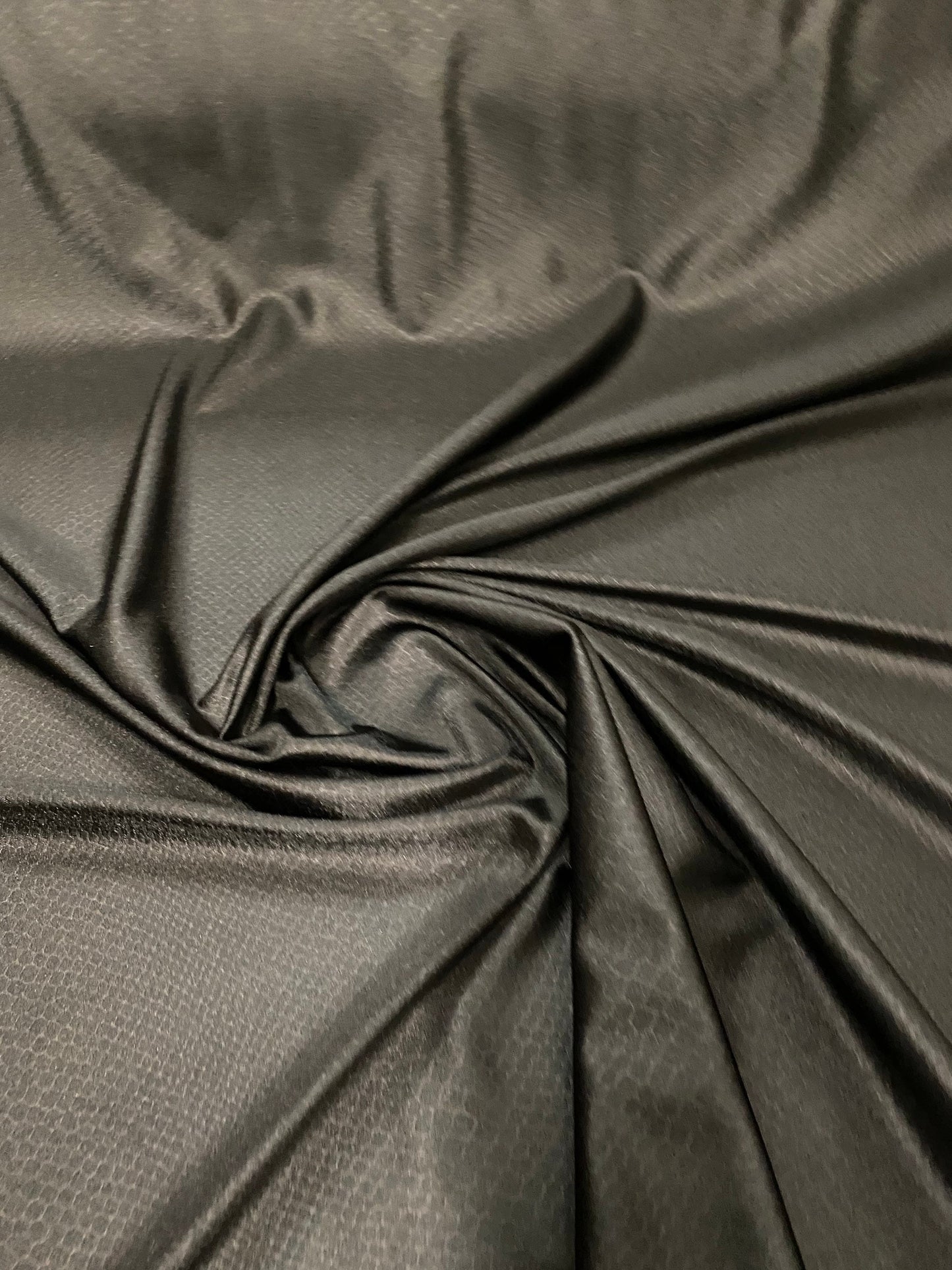 Dragon skin jumbo embossed great quality of nylon spandex 4-way stretch 58/60” Sold by the YD. Ships worldwide from Los Angeles California